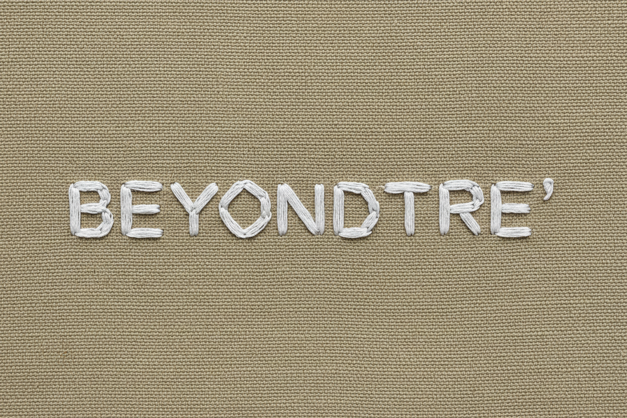 kaki textured background w "BEYONDTRE'" stiched in white